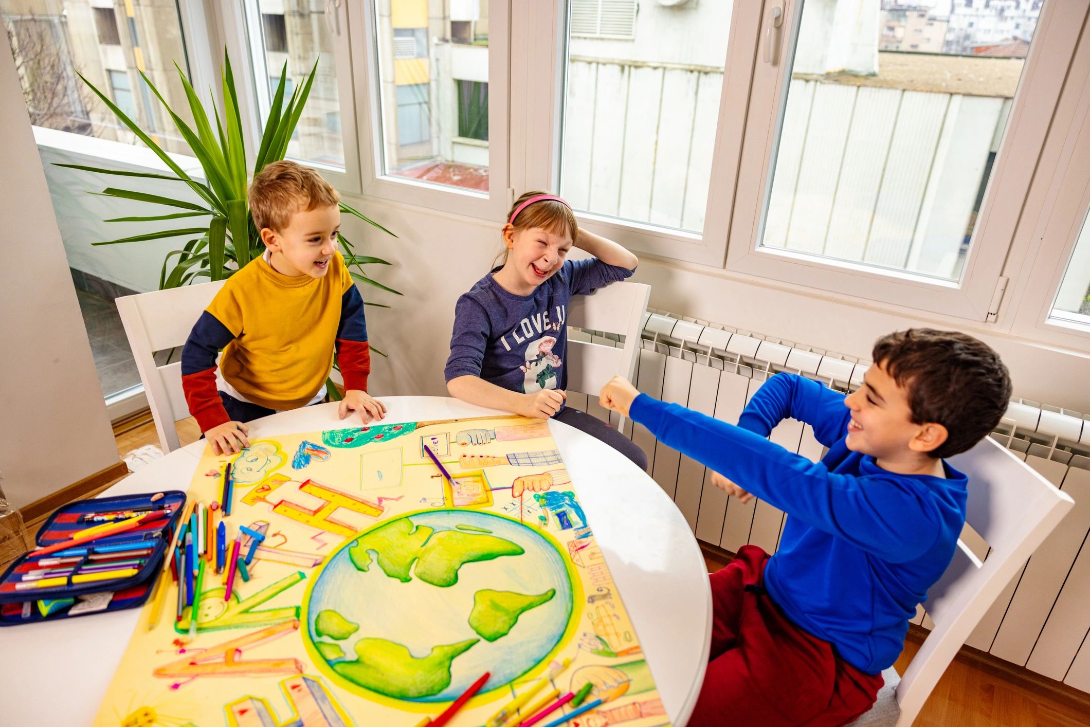 Kids playing a tabletop game together during a break