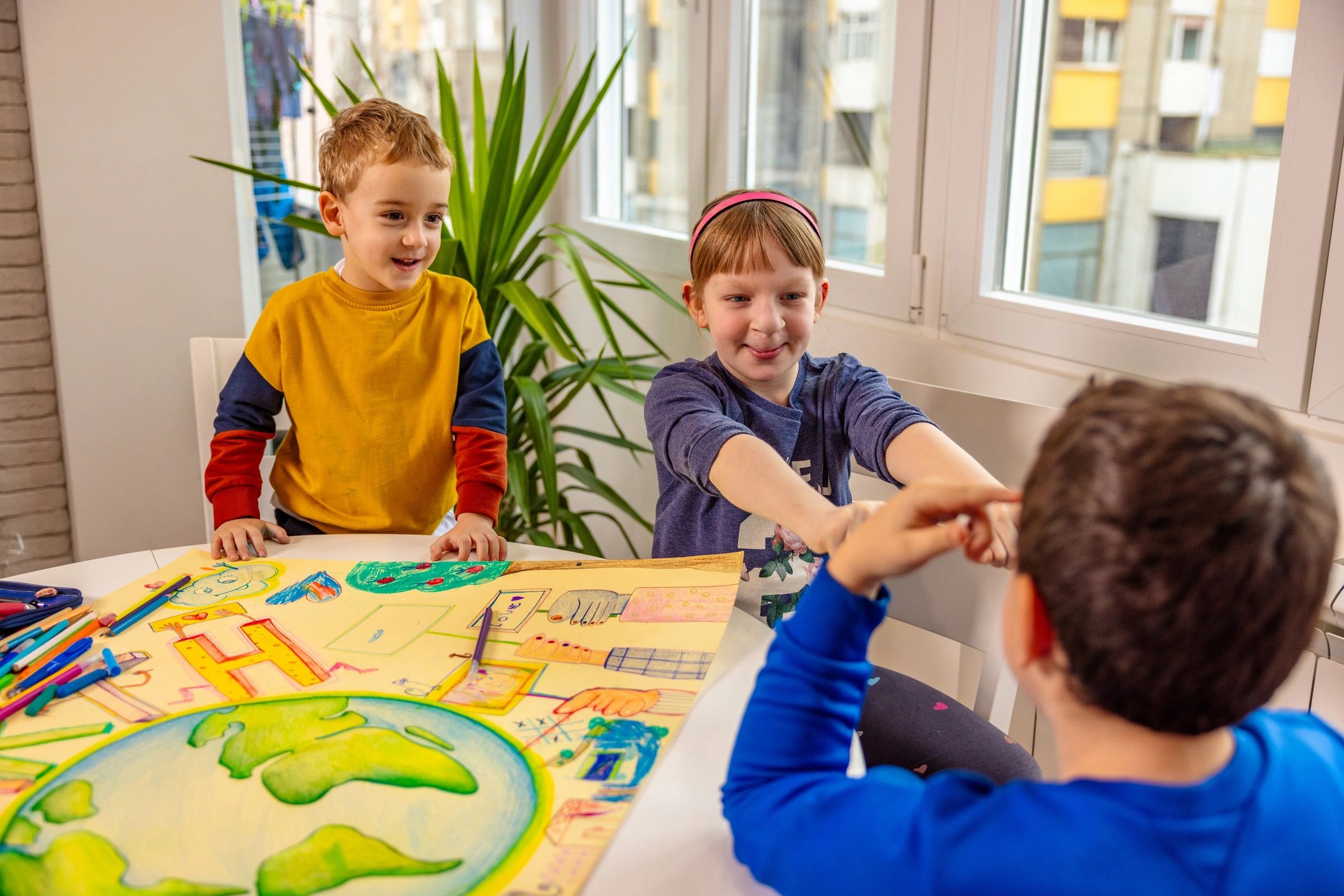 Two children playing a tabletop game together