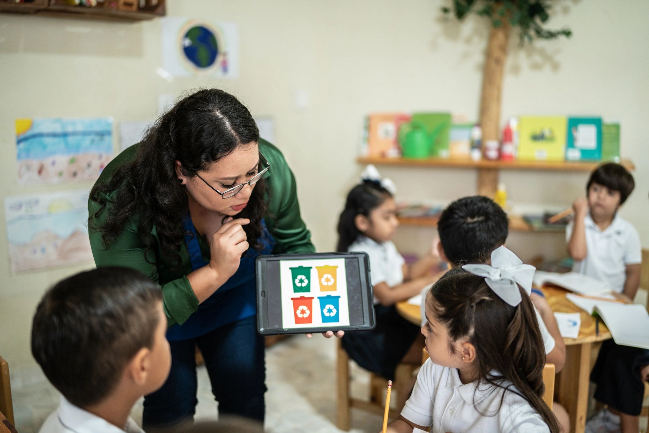 Teacher working with students in a classroom