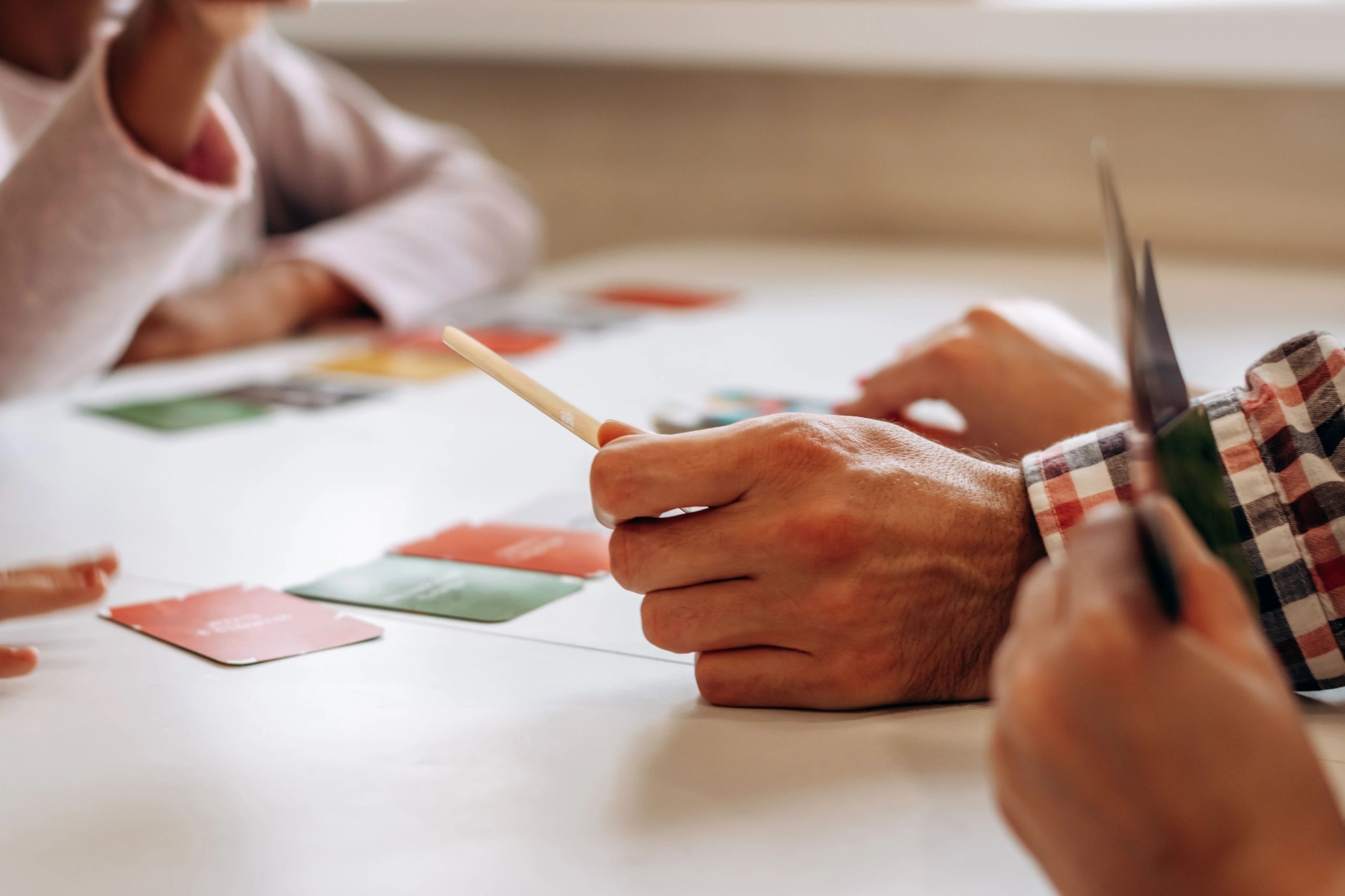 Hands moving pieces during a board game