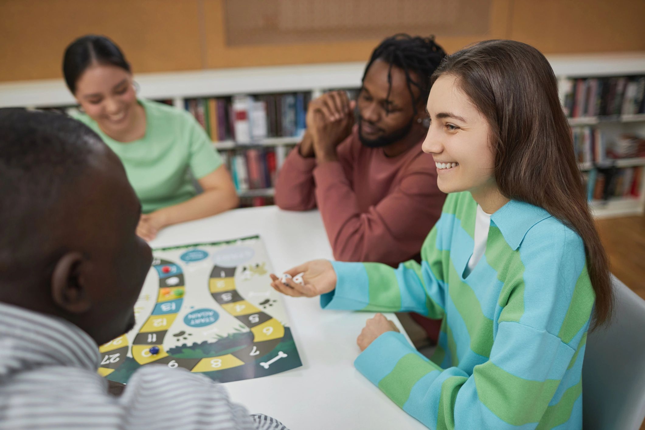 People playing a board game together at a table