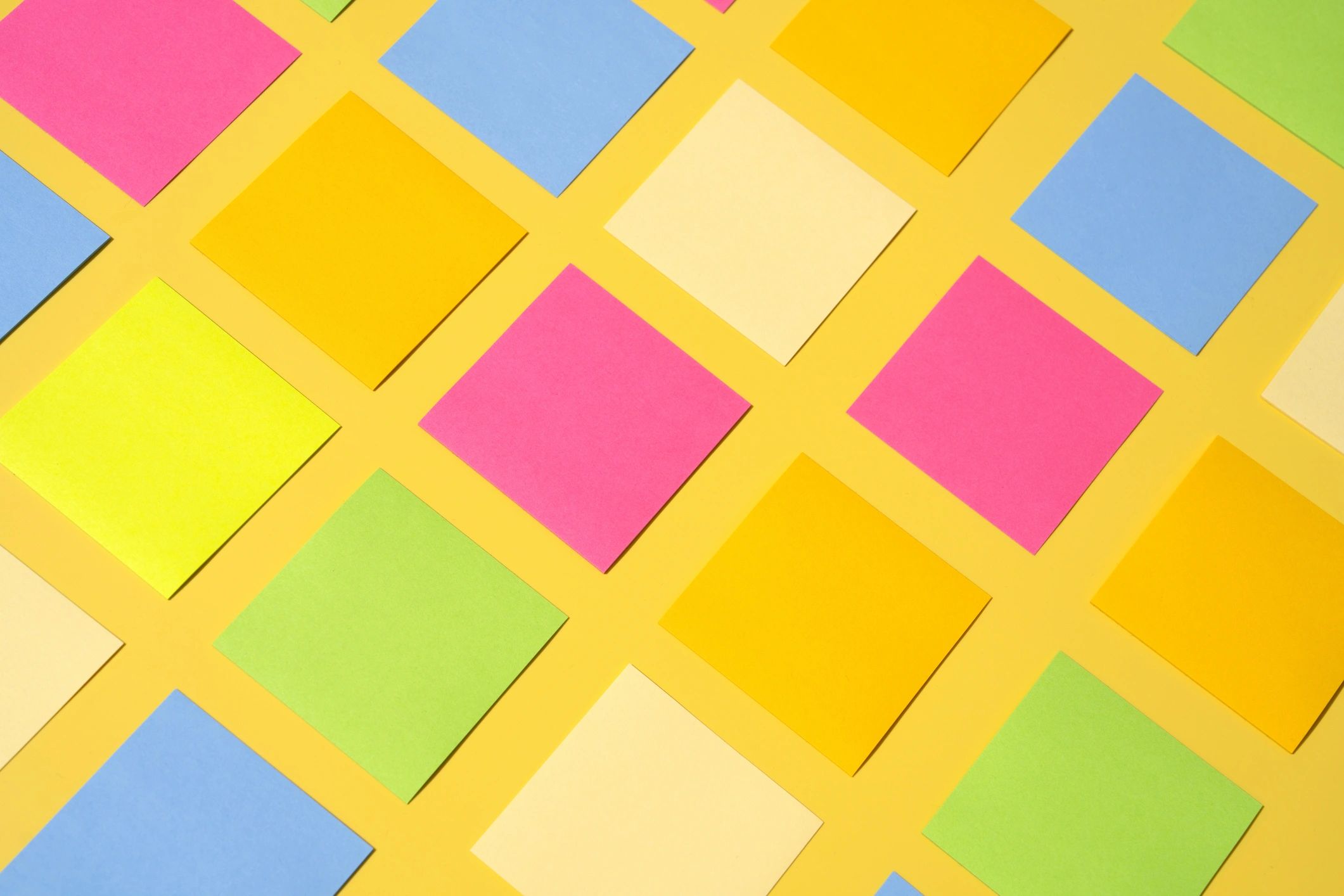 Colorful sticky notes arranged in a playful pattern